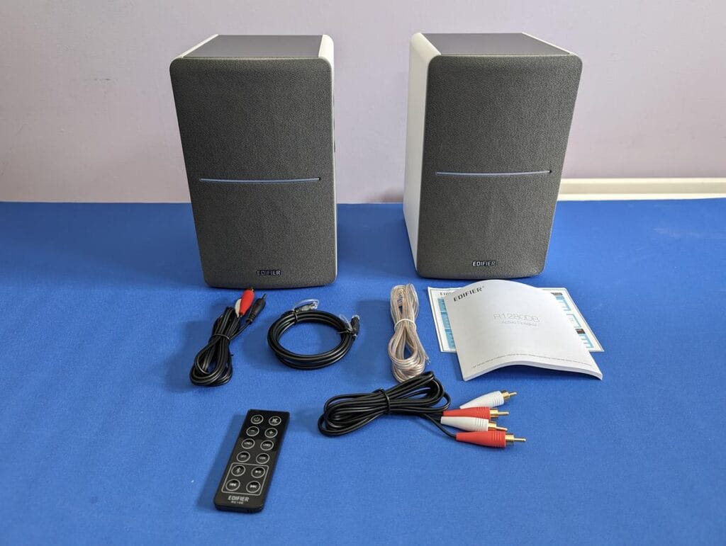 EDIFIER R1280DB Powerful Bookshelf Speakers and accessories on table